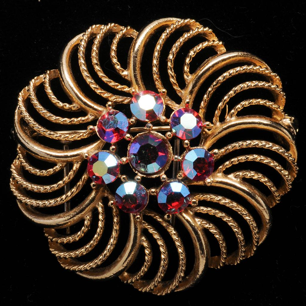 Lisner Openwork Blossom Pin with Red Aurora Rhinestone Center