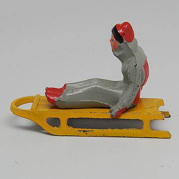 Barclay Girl on Sled Lead Dimestore Figure