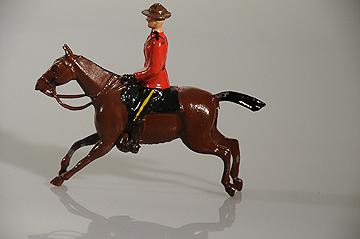 Britains Lead Hollowcast RCMP Mountie on Horseback with Rifle