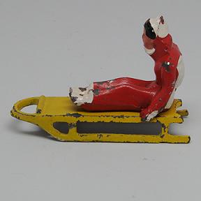 Barclay Girl on Sled Lead Dimestore Figure