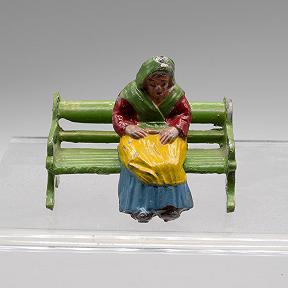 Lead model village woman seated made in France